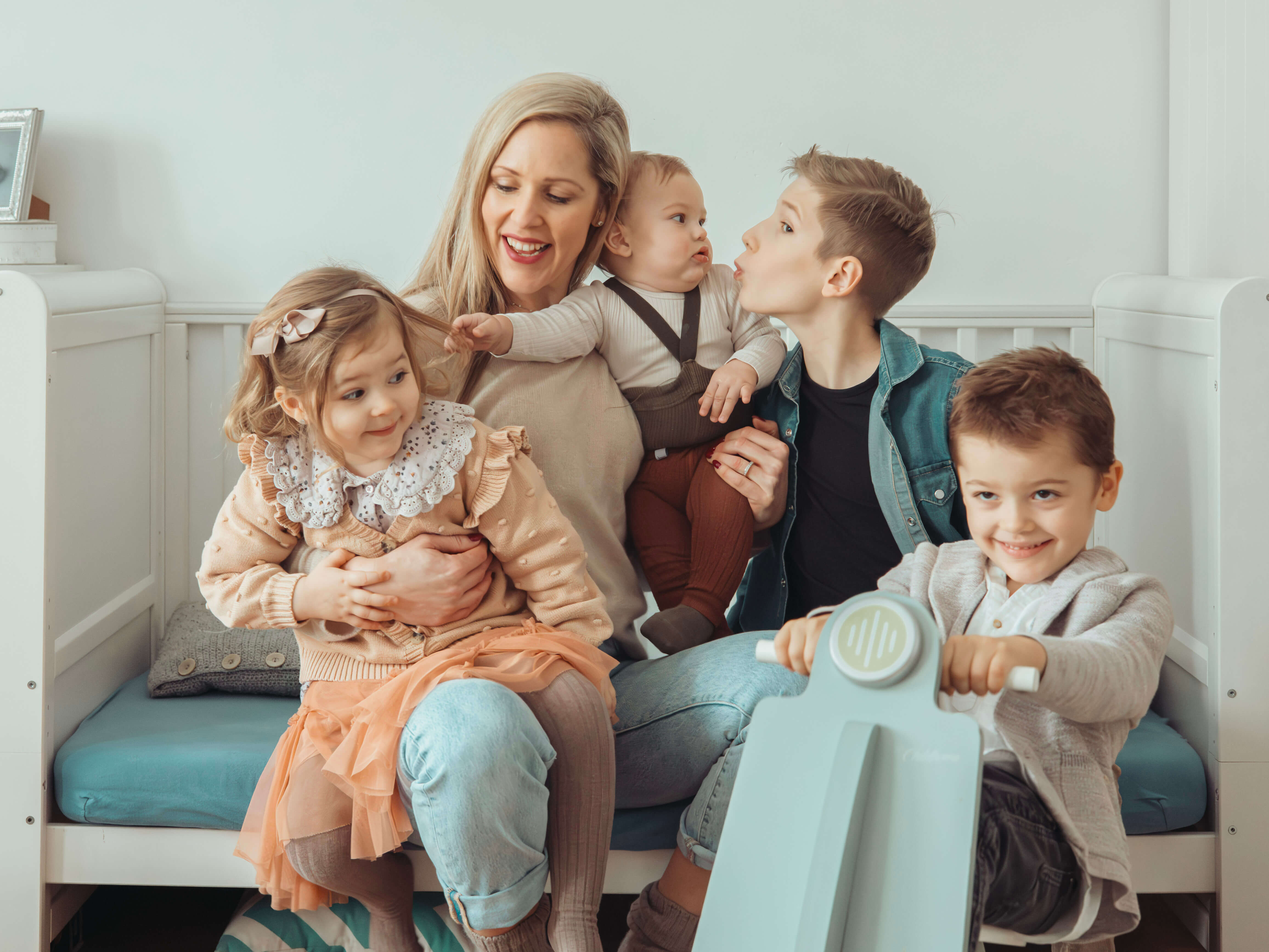 Lenka with her four children in a warm family moment
